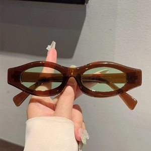 Retro oval sunglasses with brown transparent frames and light green tinted lenses