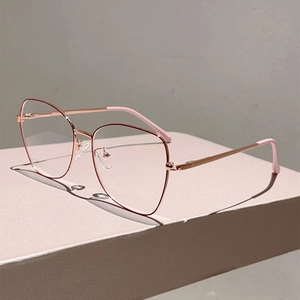 Detail of rose gold polygonal metal frame with flexible spring hinges and pink ear tips