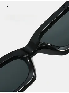 Detail of ergonomic one-piece nose pads on black square frame sunglasses for comfort