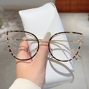 Cat eye leopard print glasses with gold metal temples and a white leather folding case
