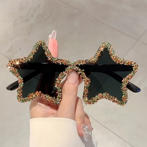 Star shaped sunglasses with colorful rhinestones and dark lenses for party wear