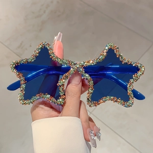 Star-shaped rhinestone sunglasses with blue lenses and crystal embellishments