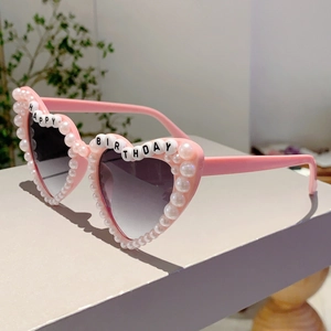 Pink heart-shaped birthday sunglasses with white pearls and Happy Birthday letter beads