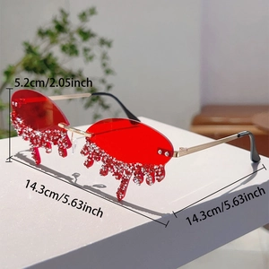 Detail of red rimless sunglasses with melting teardrop lenses and sparkling rhinestones