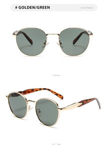 Detail view of round golden sunglasses with green lenses and tortoise temples