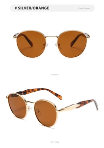 Silver metal round sunglasses with orange lenses and tortoise shell temple detail