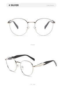 Detail view of silver round metal frame sunglasses with minimalist temples and black tips
