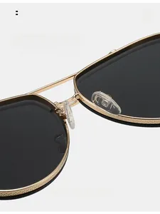 Detail of adjustable silicone nose pads and textured metal frame on pilot sunglasses