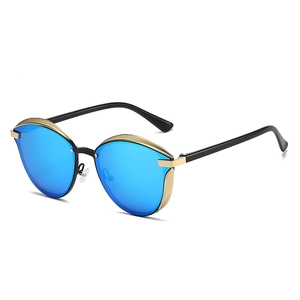Lunettes de soleil œil-de-chat rétro avec verres miroirs bleus et monture or noir