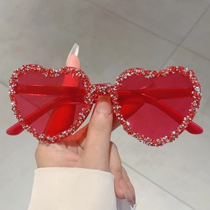 Fashionable rimless heart shaped sunglasses with sparkling red rhinestones for party