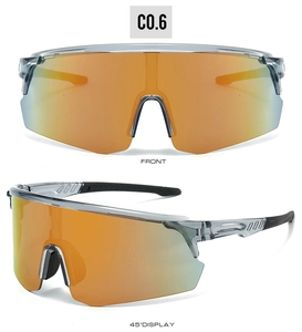 Close-up of orange mirrored lens and gray translucent frame on sports cycling glasses