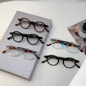 Retro round blue light blocking glasses in black, tortoiseshell and translucent colors