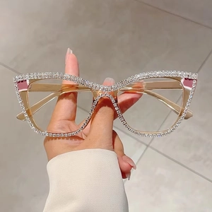 Detail of cat-eye frames with hand-set rhinestones and transparent light brown finish
