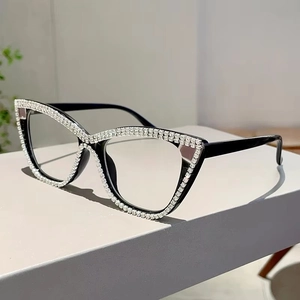 Detailed side view of cat-eye glasses frame featuring double rows of white rhinestones