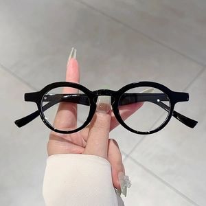 Retro round black frame glasses with clear blue light blocking lenses for a classic look