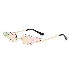 Frameless flame-shaped sunglasses with pink gradient lenses and gold metal temples