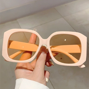 Classic rectangular sunglasses with creamy pink thick frames and dark brown lenses