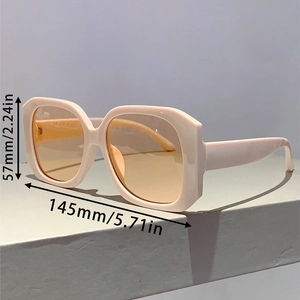 Detailed view of cream square frame sunglasses with precise 57mm lens height measurements