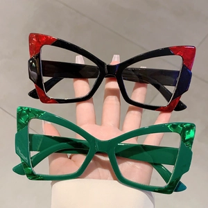 Retro cat-eye sunglasses with thick frames and colorful marble patterns for a modern look