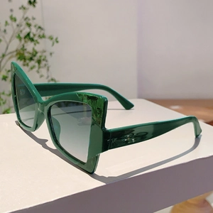 Detail view of green marble pattern frame sunglasses with gradient grey lenses