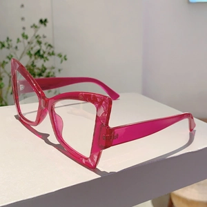 Detail of trendy cat-eye glasses frame in transparent rose pink marble texture