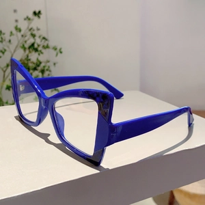Detailed side view of royal blue cat-eye glasses frame with marble texture accents