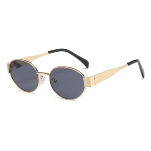 Vintage oval sunglasses with slim gold metal frames and dark grey lenses for a retro look