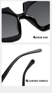 Detail view of ergonomic nose pads and curved temples on black oversized sunglasses