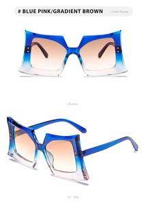 Detail of oversized butterfly sunglasses with blue pink gradient frame and brown lenses