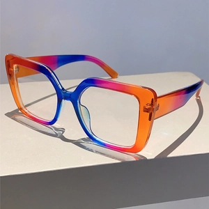 Close-up of stylish large square glasses frame with orange, pink and blue gradient colors