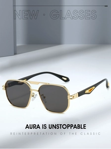 Detail of gold metal double bridge aviator sunglasses with textured frame and dark lenses