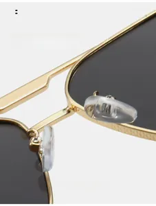Macro detail of comfortable silicone nose pads and gold metal bridge of sunglasses