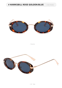 Detail view of oval tortoise shell sunglasses with rose gold metal and blue lenses