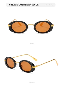 Detail view of oval retro sunglasses with black frames and light orange lenses