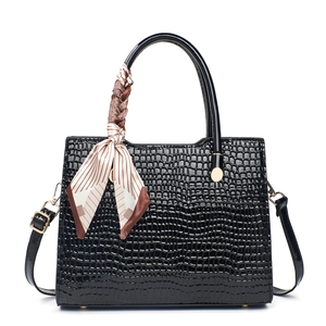 Elegant black crocodile embossed tote bag with glossy finish and decorative silk scarf