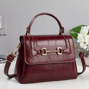 Fashionable dark red crocodile pattern handbag with gold horsebit buckle and strap