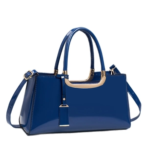 Glossy dark blue patent leather handbag with gold metal hardware and mirror finish