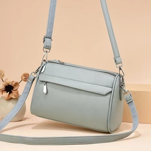 Chic light green cylindrical crossbody bag with lychee texture and multi-zipper design