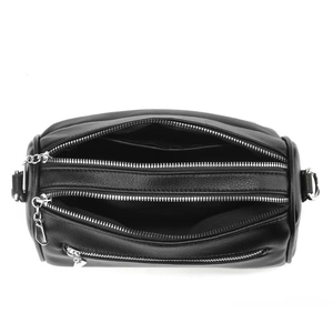 Top view of black pebbled leather crossbody bag with three main zipper compartments