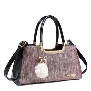 Lavender glitter handbag with black patent leather handles and pearl plush charm
