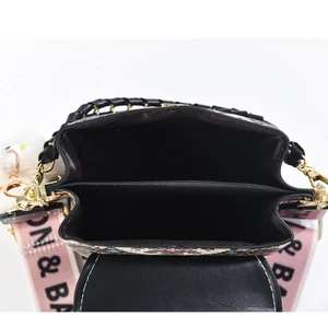 Top view of compact crossbody bag with dual compartments and printed fabric strap