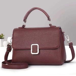 Elegant wine red leather crossbody bag with silver buckle and adjustable strap