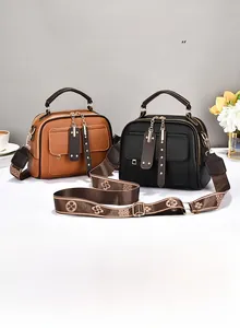Litchi pattern leather handbags with fringe tassels and patterned wide shoulder straps