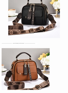 Detail of lychee textured handbags with vintage patterned wide straps in black and brown