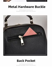 Detail of black pebbled leather handbag featuring gold metal hooks and a back zipper pocket