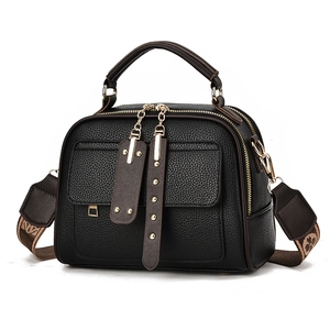 Elegant black lychee grain doctor bag with contrast brown handles and floral strap
