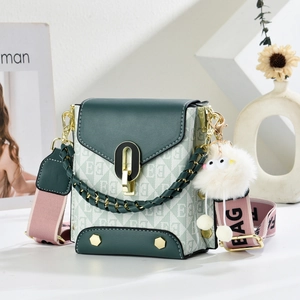 Green crossbody bag with letter patterns, wide logo strap and plush charm for women