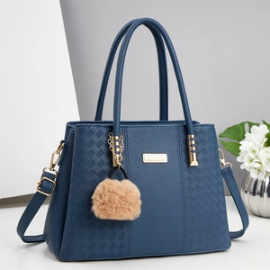 Navy blue faux leather tote bag with diamond pattern and soft plush keychain pendant