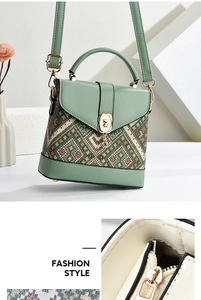 Detail of Morandi green crossbody bag with ethnic weave texture and gold bear clasp