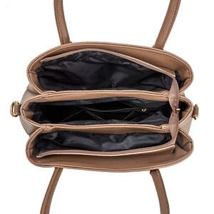 Interior detail of a brown lychee leather tote bag showing multi-layer compartments